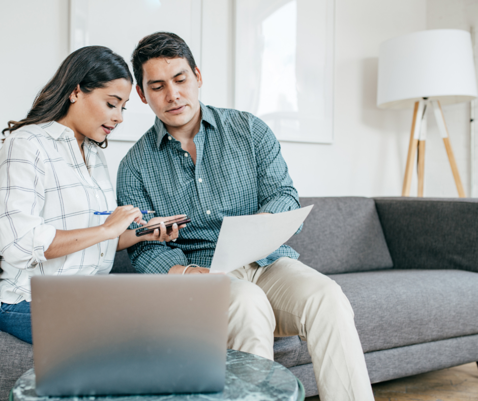 Image of couple looking and preparing their family taxes