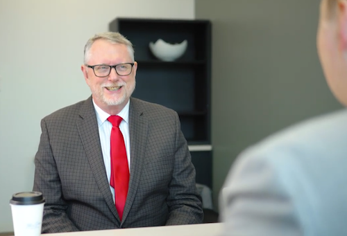 Tax advisor helping small business owners with their tax preparation